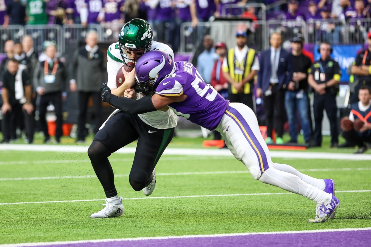 New York Jets quarterback Mike White (5) is tackled by Minnesota Vikings linebacker Jordan Hicks (58). Mandatory Credit: Matt Krohn-USA TODAY Sports